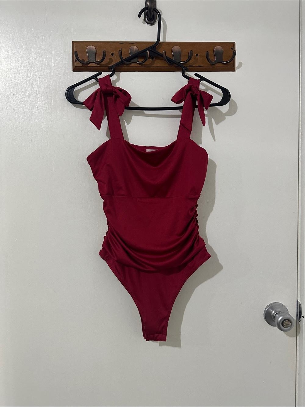 Kit + Sky Tie-Shoulder One-Piece bodysuit in Deep Wine red